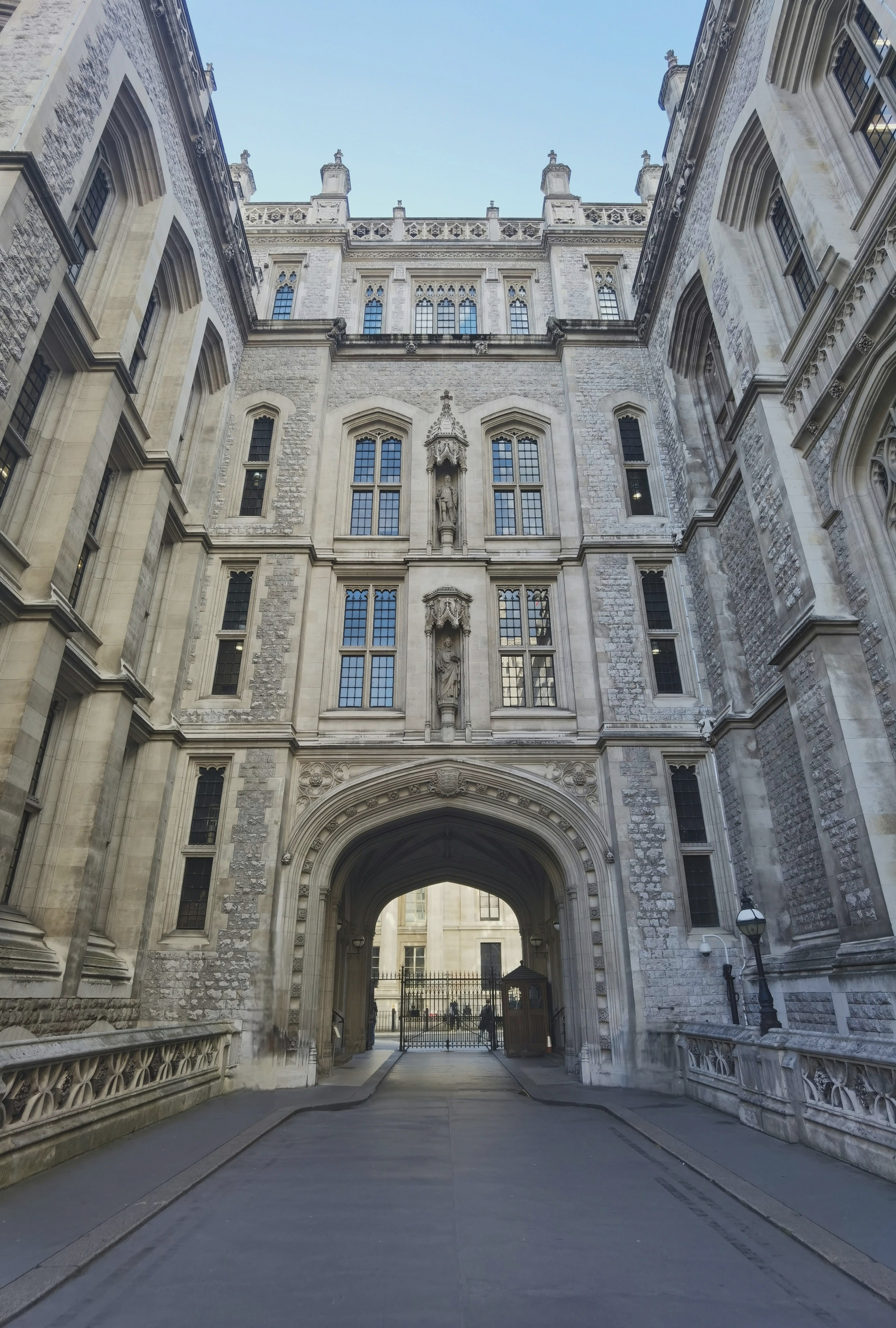 Unsplash. The neo-Gothic arch of the Maughan Library in London on a sunny day.